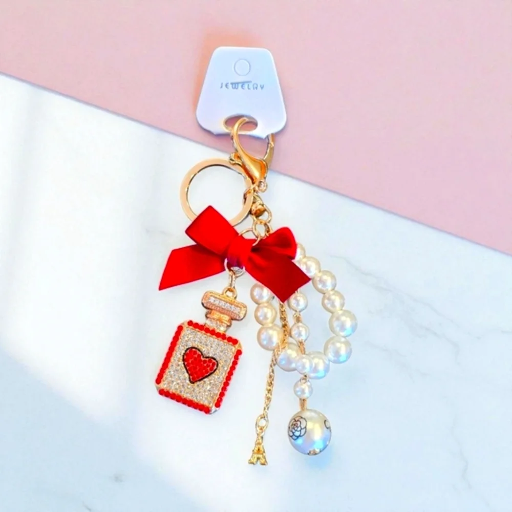 Elegant Red and Gold Perfume Bottle Shaped Charm with Pearl Accents